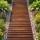 Gardeon 8FT Charcoal Brown Cedar Garden Walkway: Weather-Resistant, Anti-Slip, Roll-Up Path with Stakes for Easy Storage